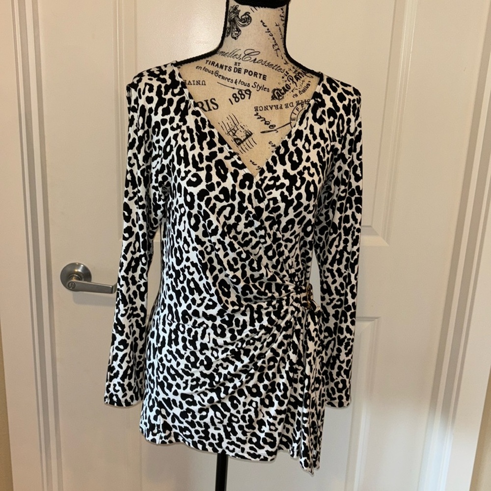 Cache long sleeve top with beautiful details.